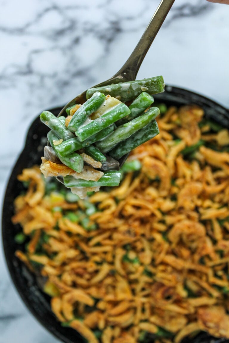A spoon full of green bean casserole.