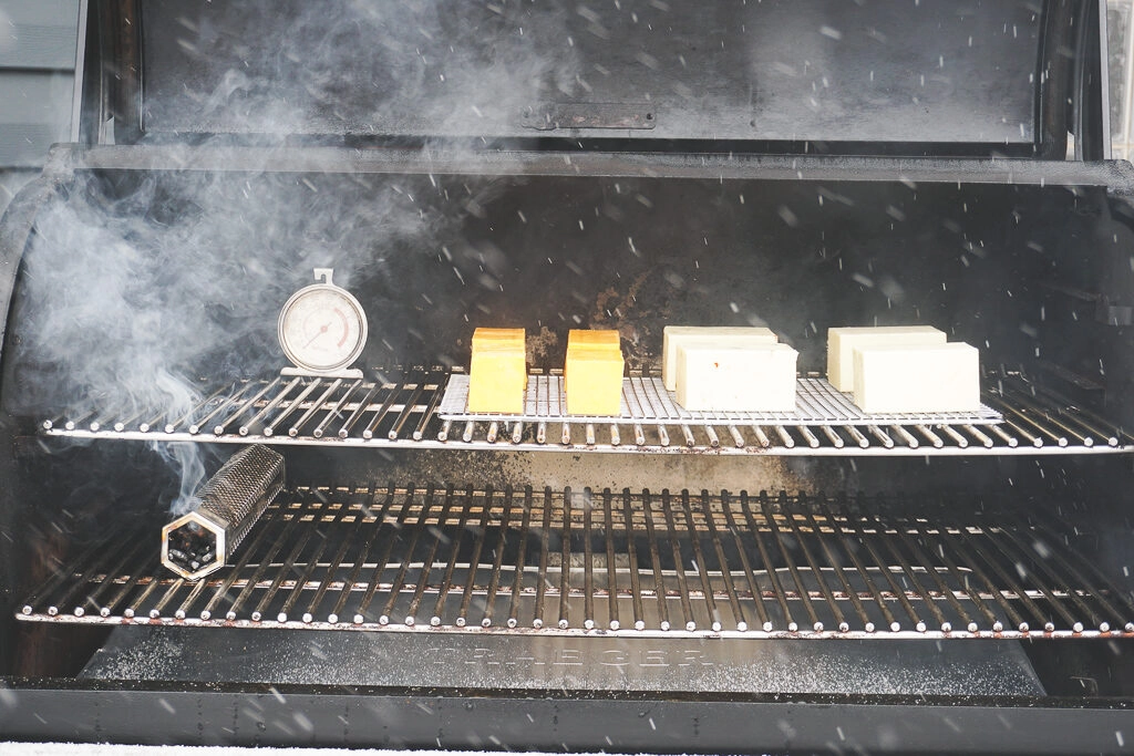 Cheese on the smoker - a smoke tube is burning.