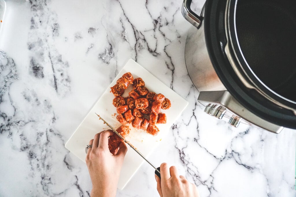 Slicing italian sausages into 3/4" rounds. 