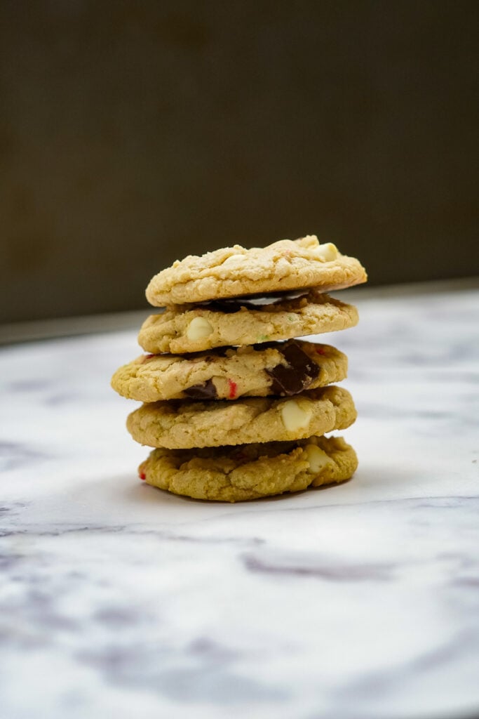 5 candy cane cookies stacked in a pile