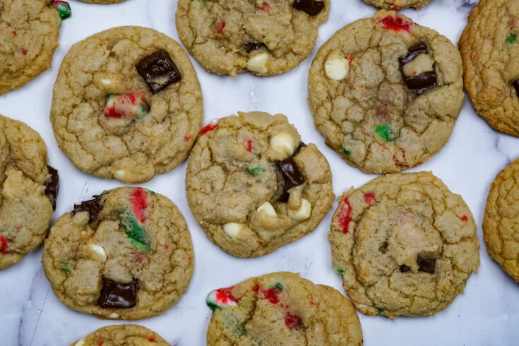 a bunch of candy cane cookies spread on a counter.