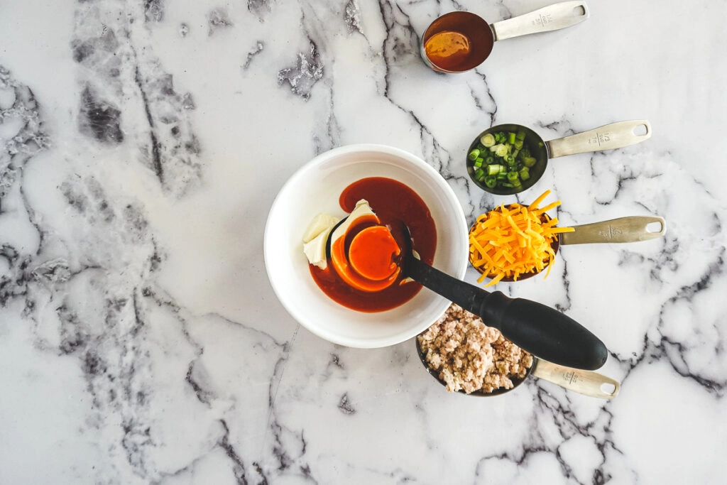 Ingredients spread around a mixing bowl.
