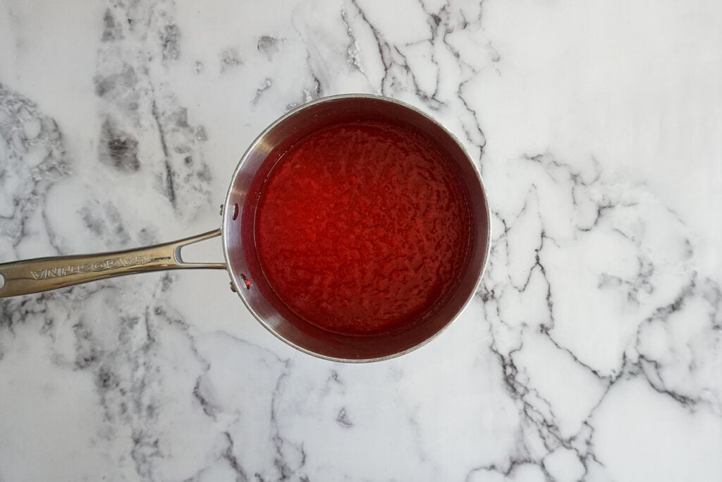 Strawberry flavor syrup in a saucepan. 