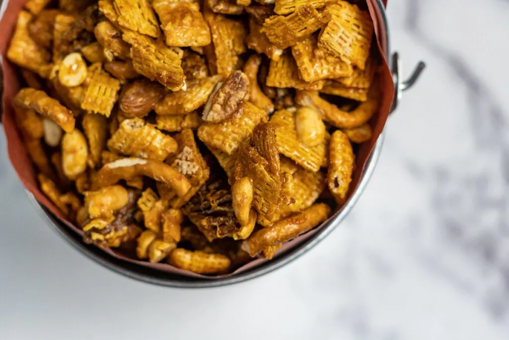 Close up of the sriracha caramel coating on the traeger smoked chex mix.