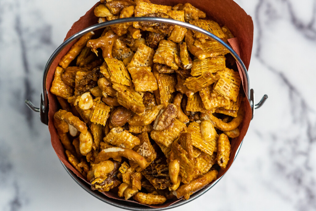 Smoked chex mix in a bucket.