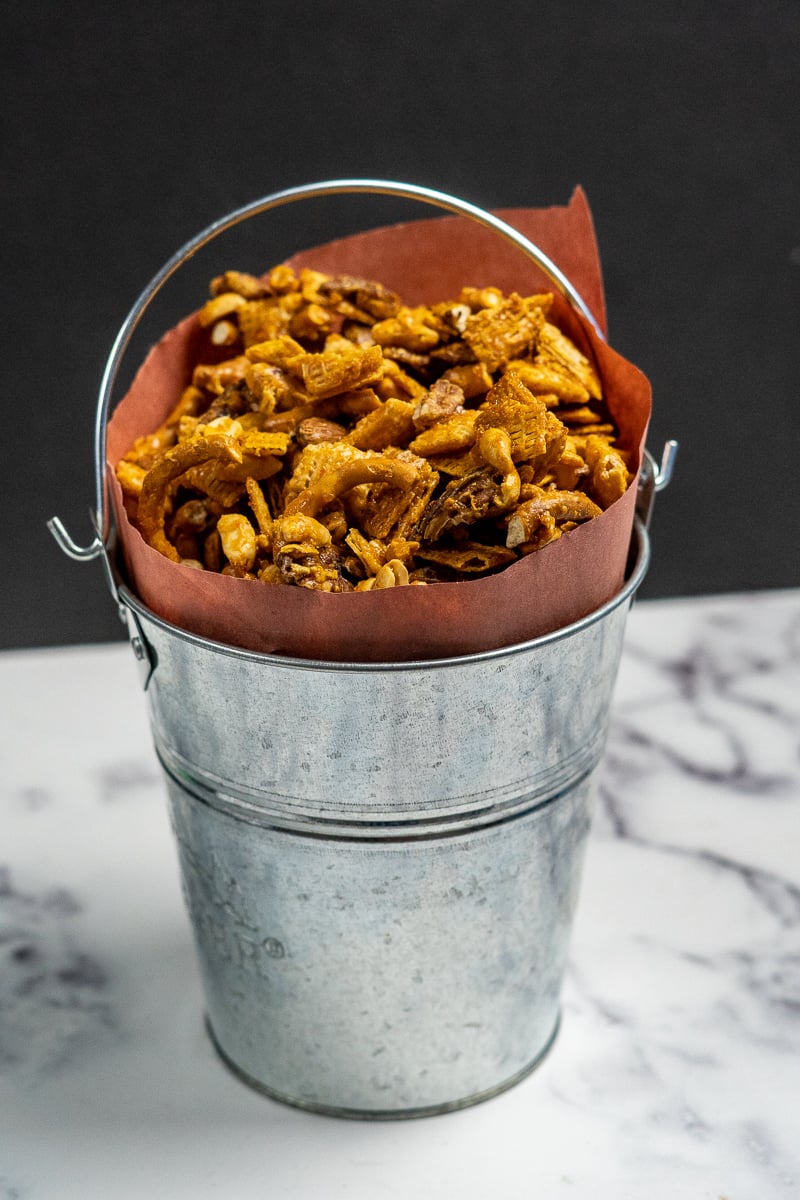 Smoked chex mix in a bucket.
