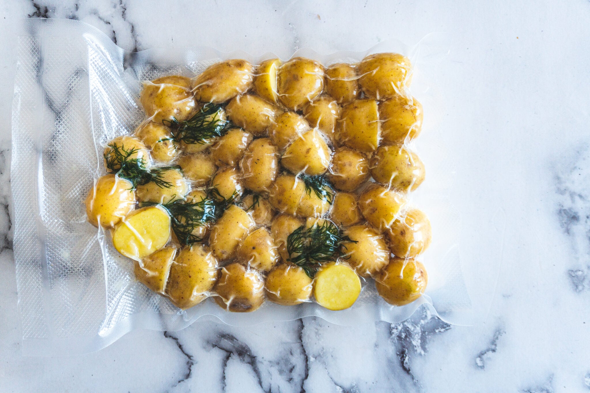 A vacuum bag of sous vide potatoes after cooking.