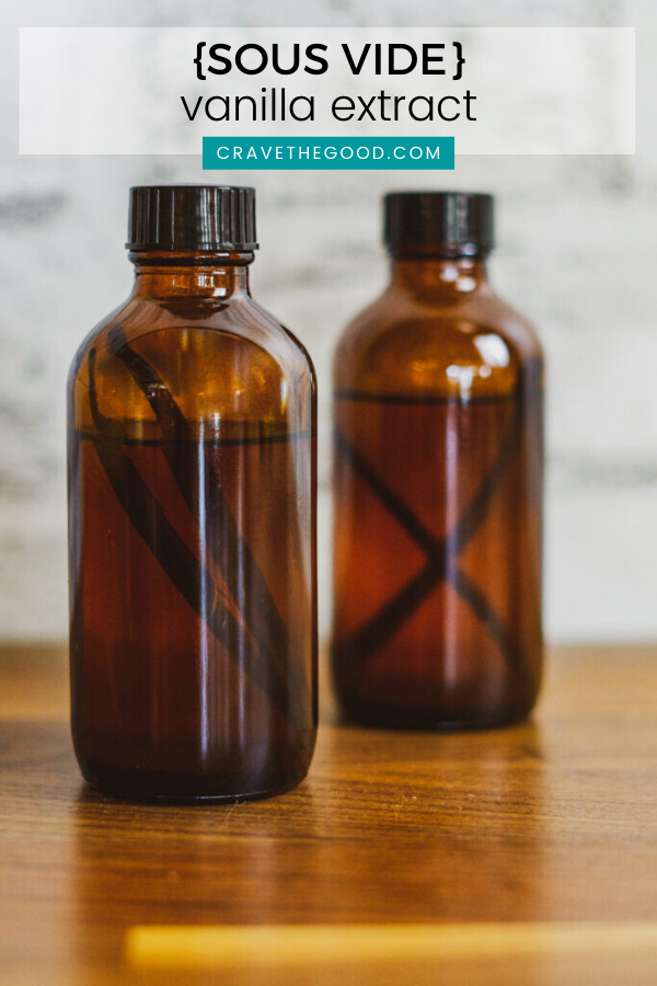 Two bottles of vanilla extract with vanilla beans in them.