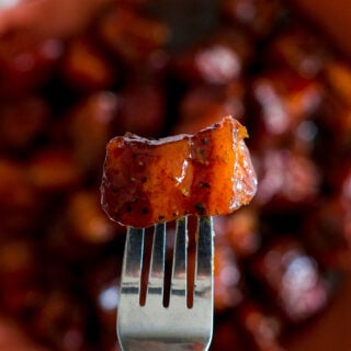 A smoked burnt end on a fork.