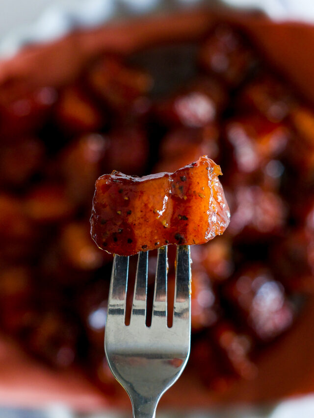 A smoked burnt end on a fork.