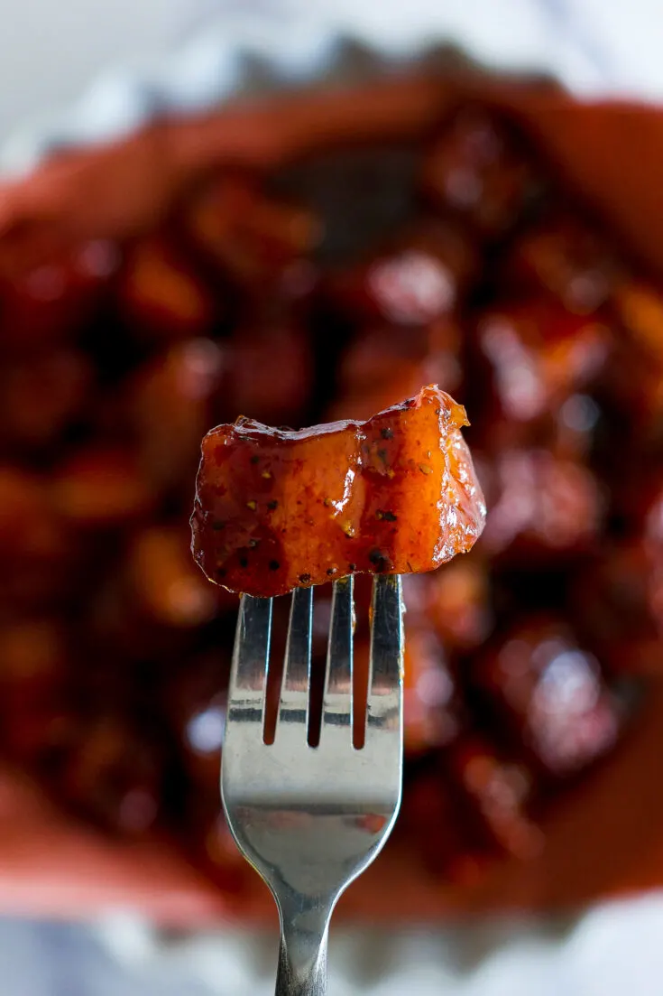 A smoked burnt end on a fork.