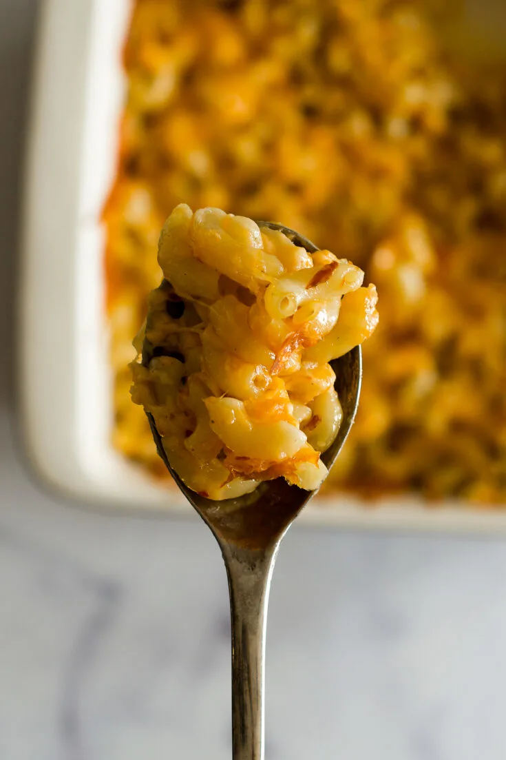Smoked mac and cheese on a serving spoon.