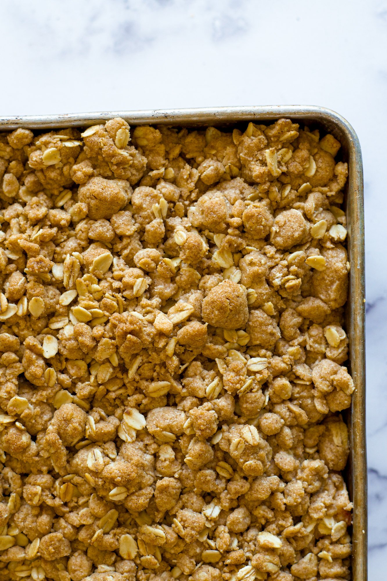 Overhead view of apple crisp in a pan.