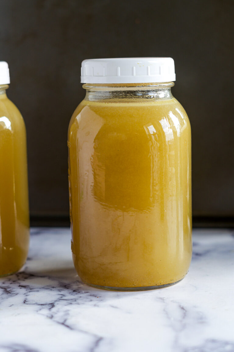 Smoked turkey broth in a large mason jar.