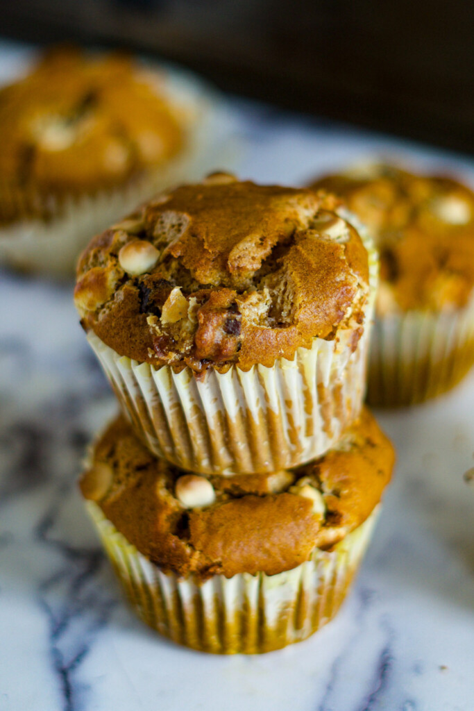 Stacked jumbo chocolate chip pumpkin muffins.