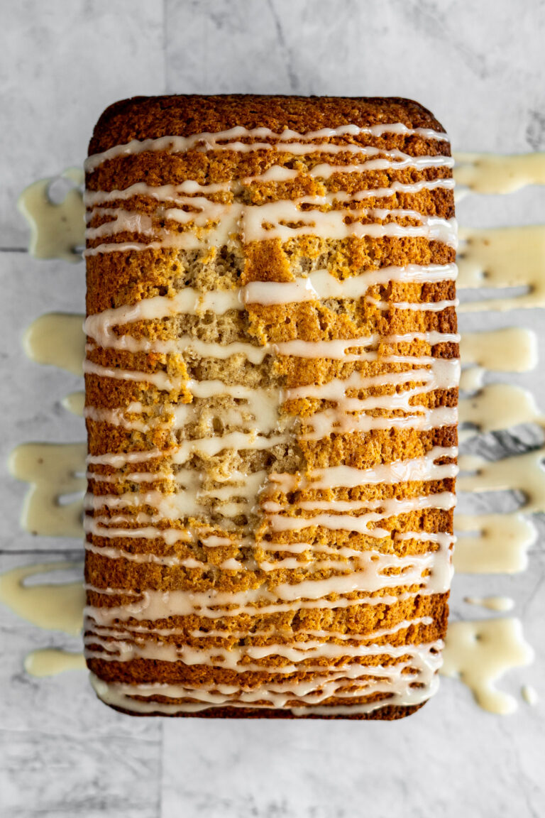 Eggnog bread drizzled with eggnog glaze.