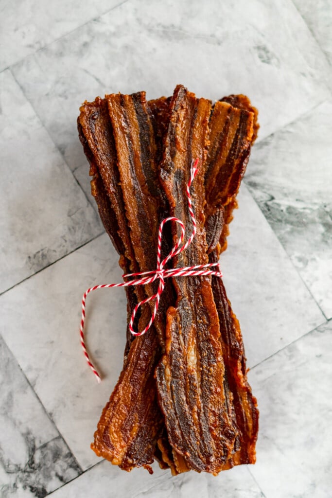 Bacon jerky wrapped in red and white twine.