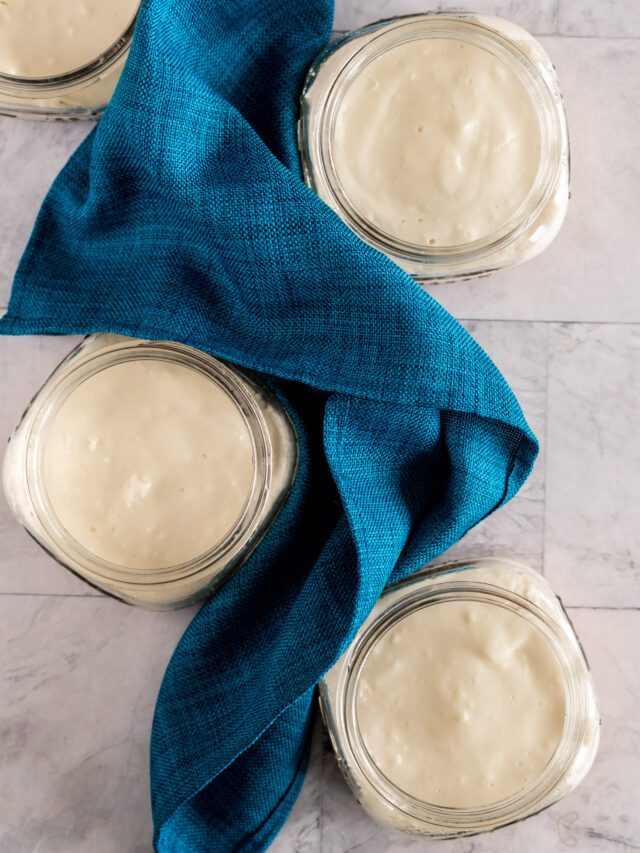 4 sous vide cheesecakes wrapped around a blue napkin.
