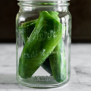 Frozen whole jalapenos in a mason jar.