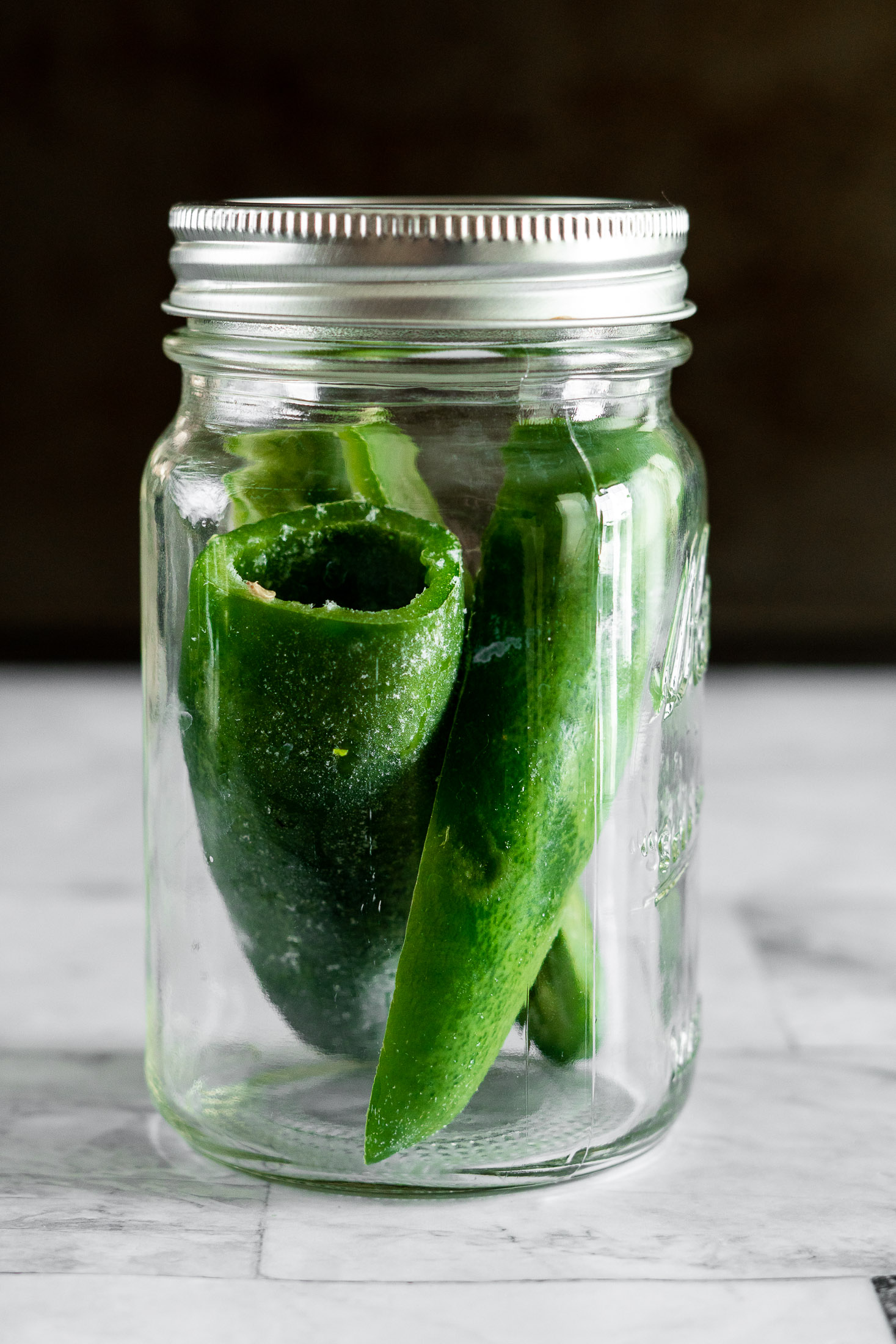 Frozen whole pepper in a mason jar.