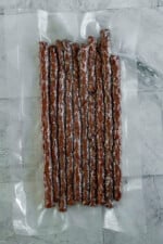 Vacuum sealed beef jerky sticks.