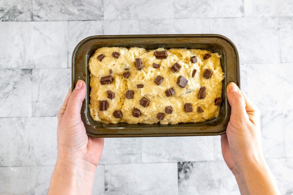 Carrying the banana bread to the oven.