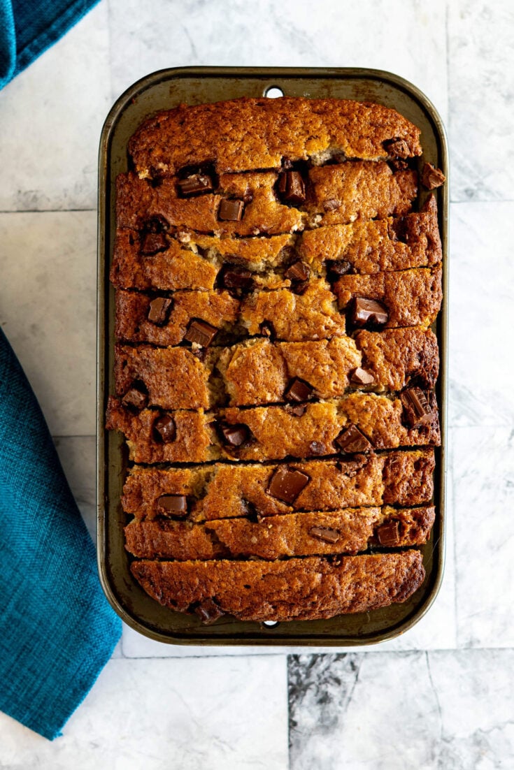 Sliced sourdough banana bread in a loaf pan.