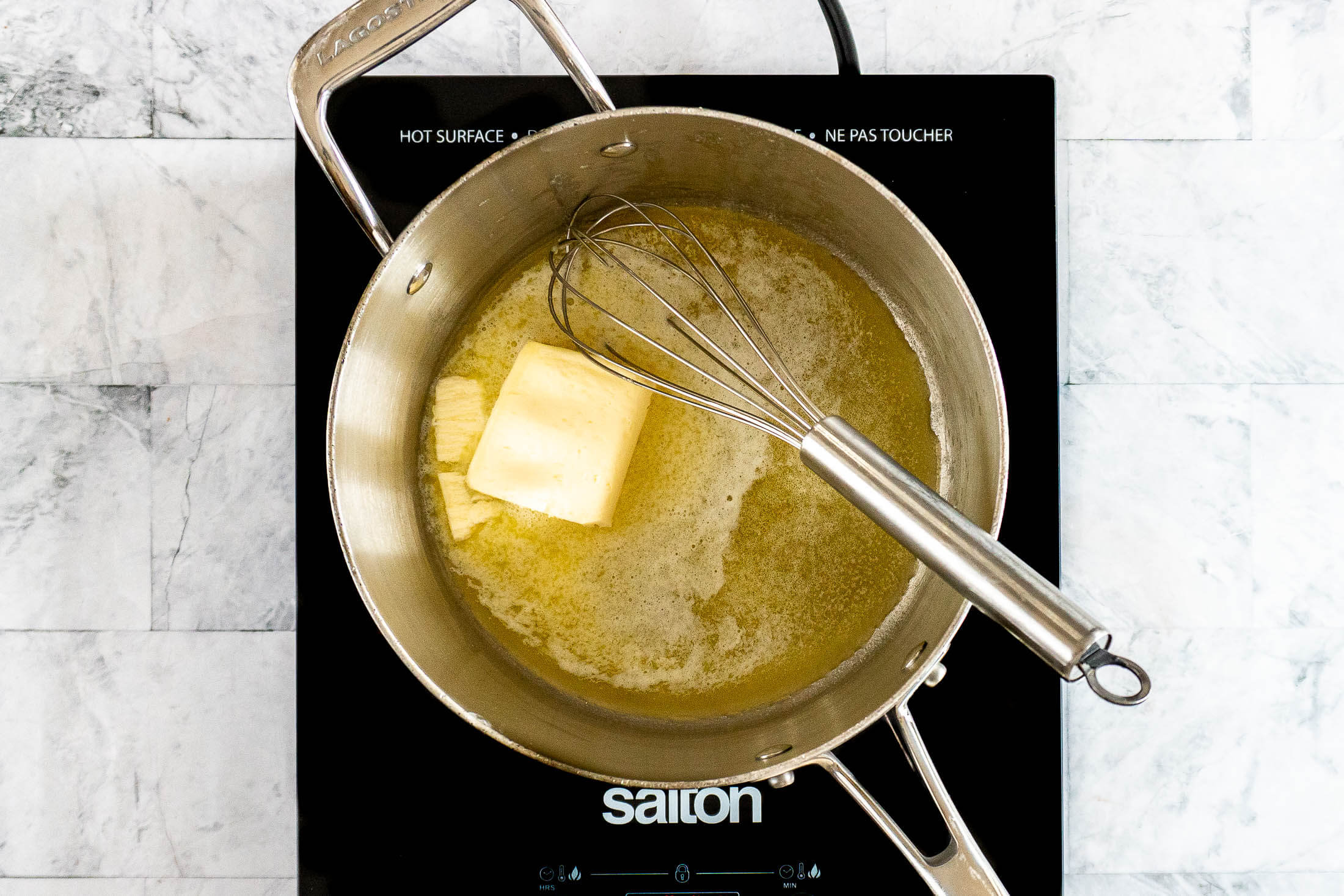 Melting butter in a sauce pan.