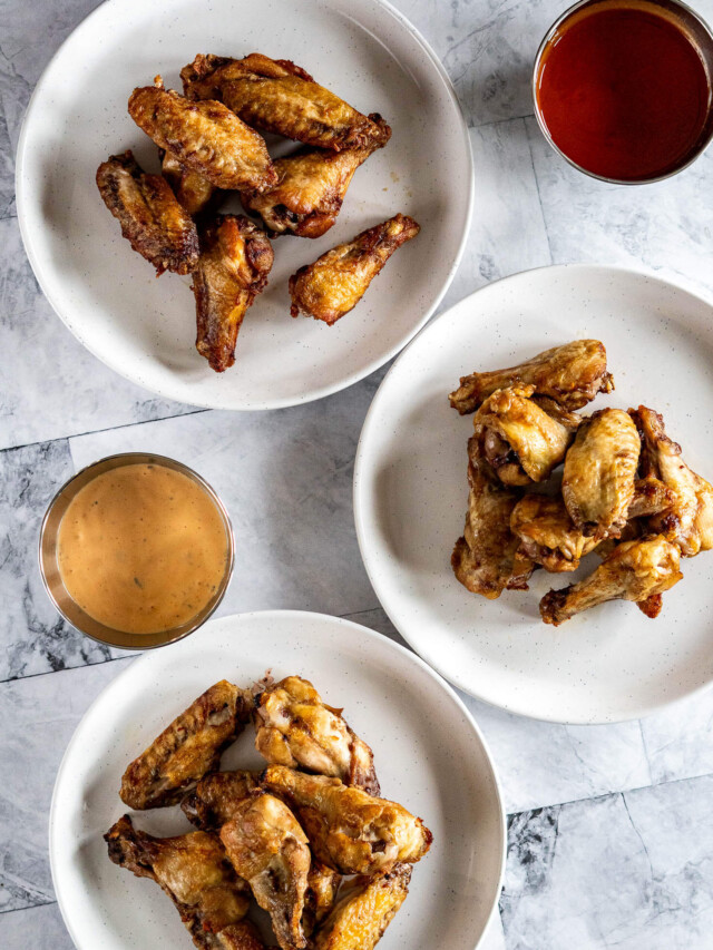 Sous vide chicken wings on 3 plates.