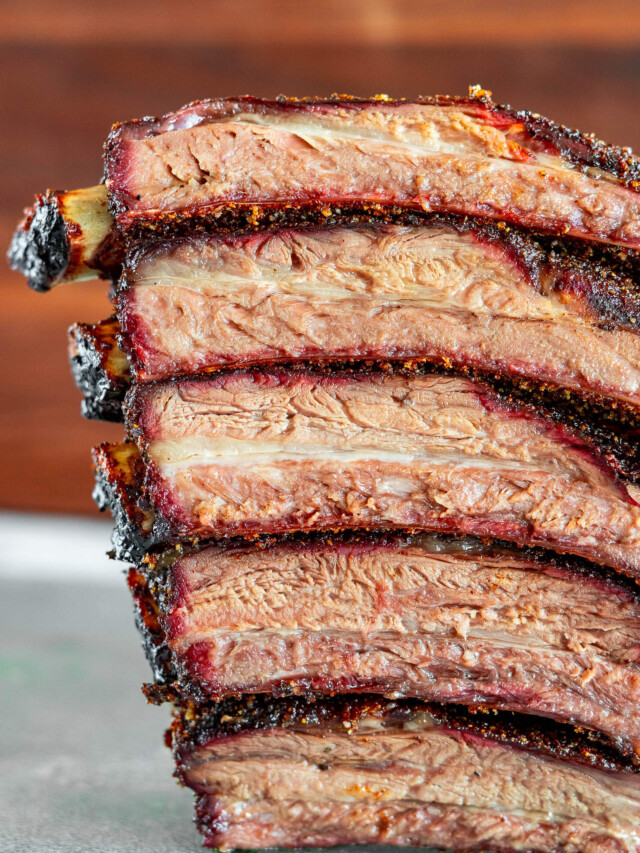 Smoked beef back ribs, sliced and stacked.