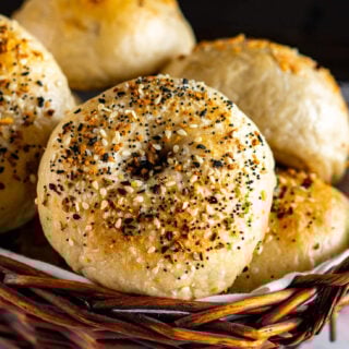 Close up of sourdough bagels in a basket.