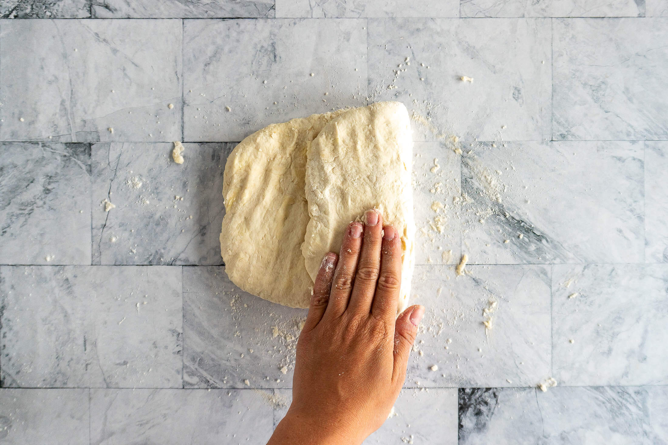 Folding the biscuit dough into thirds.