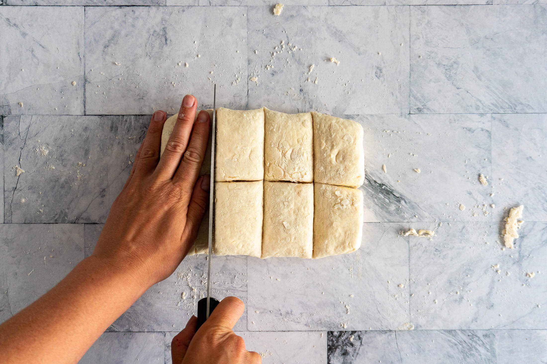 Cutting the dough into even pieces.