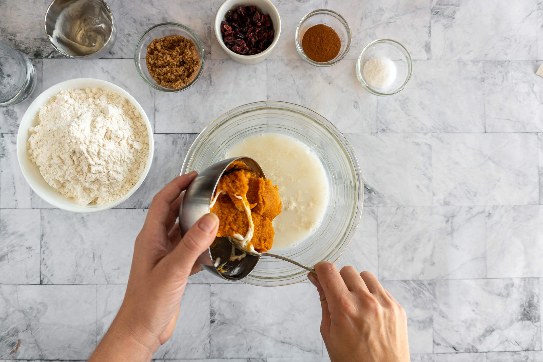 Mixing pumpkin puree with the water and sourdough starter.