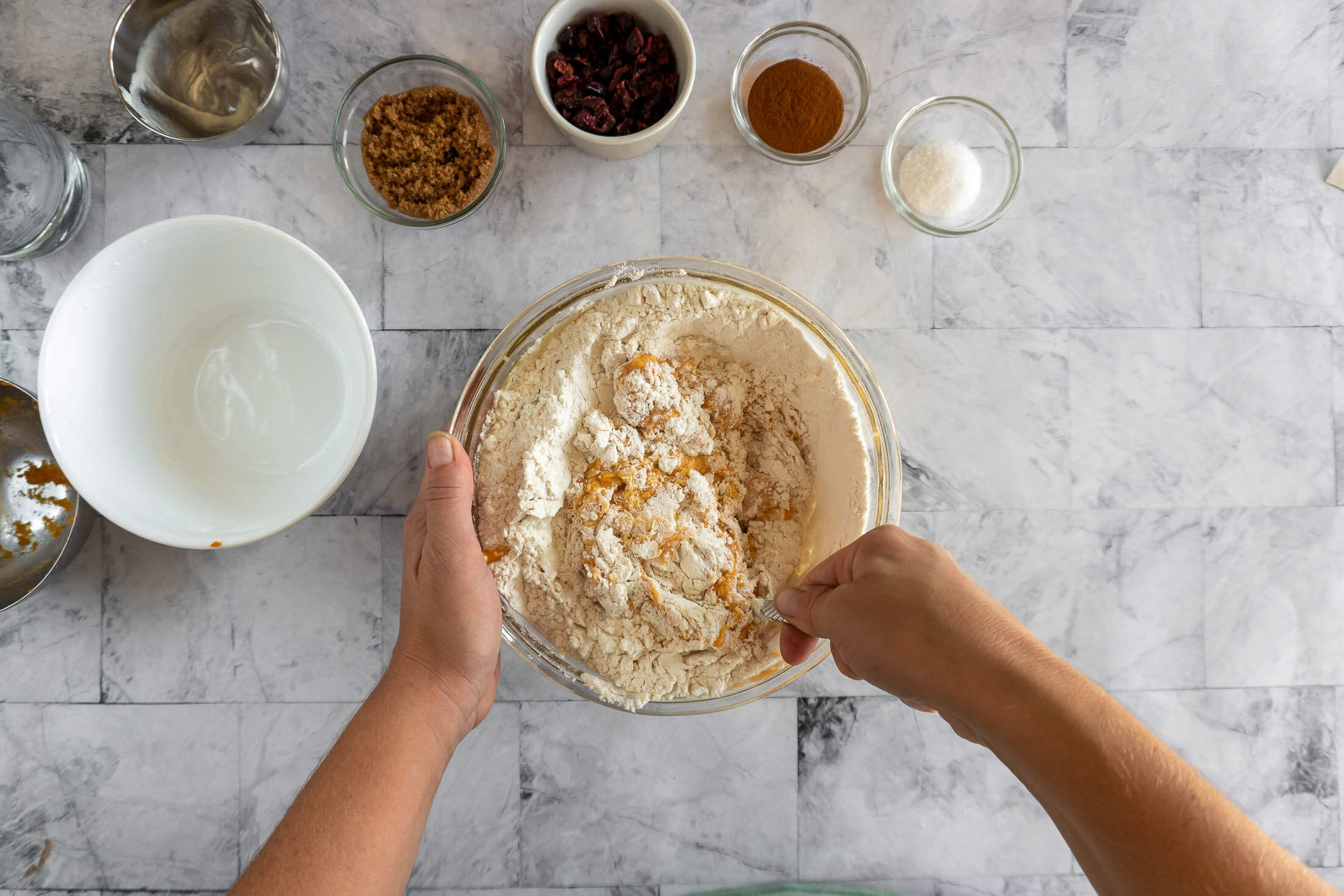 Stirring in the flour.