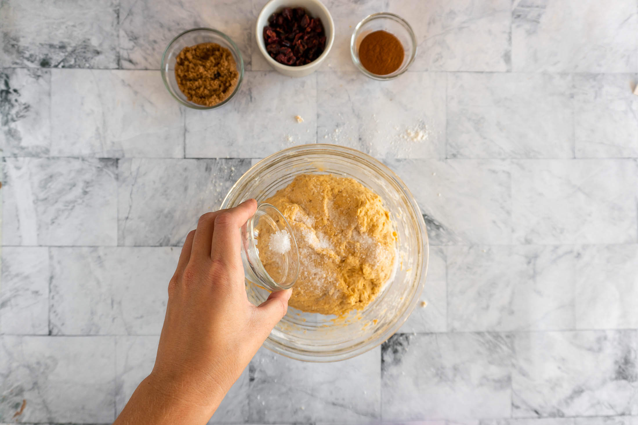Adding salt to the dough.