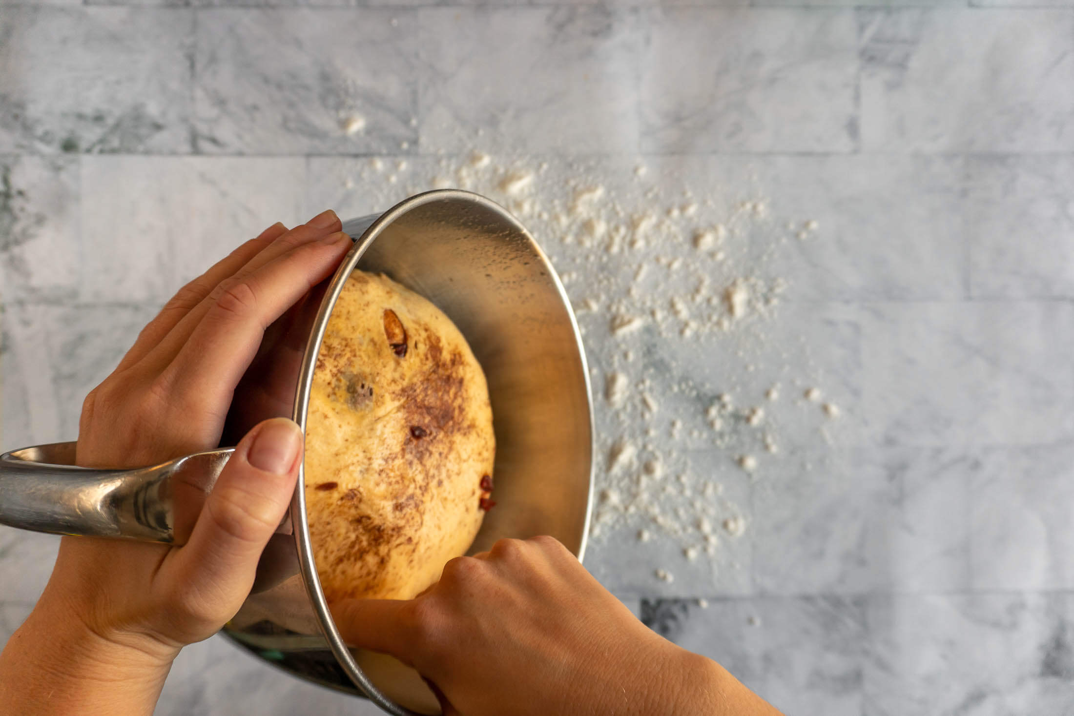 Turning the dough onto a floured surface.