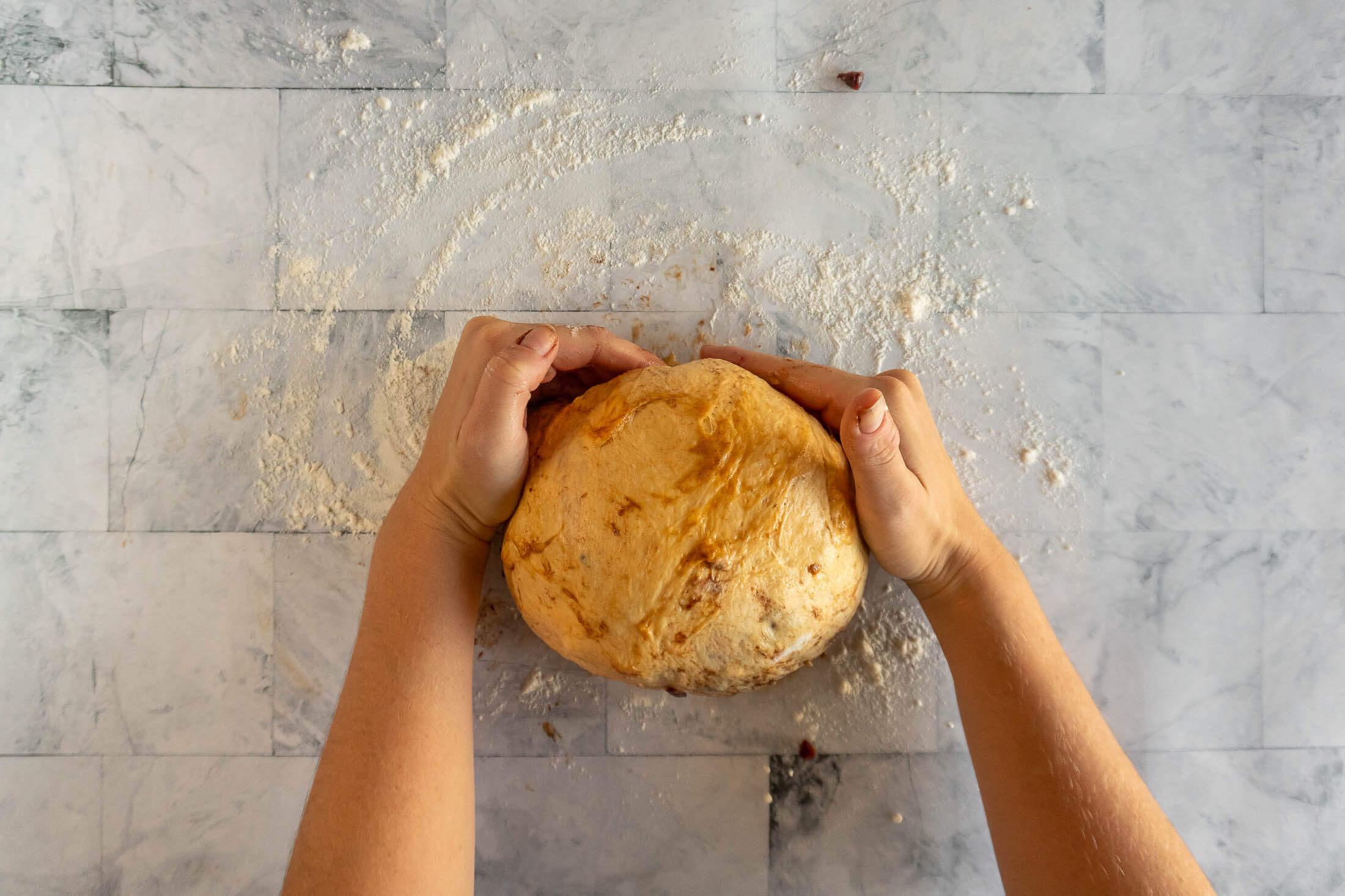 Forming the dough into a boule.