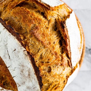 Close up of the split crust on the sourdough rye loaf.