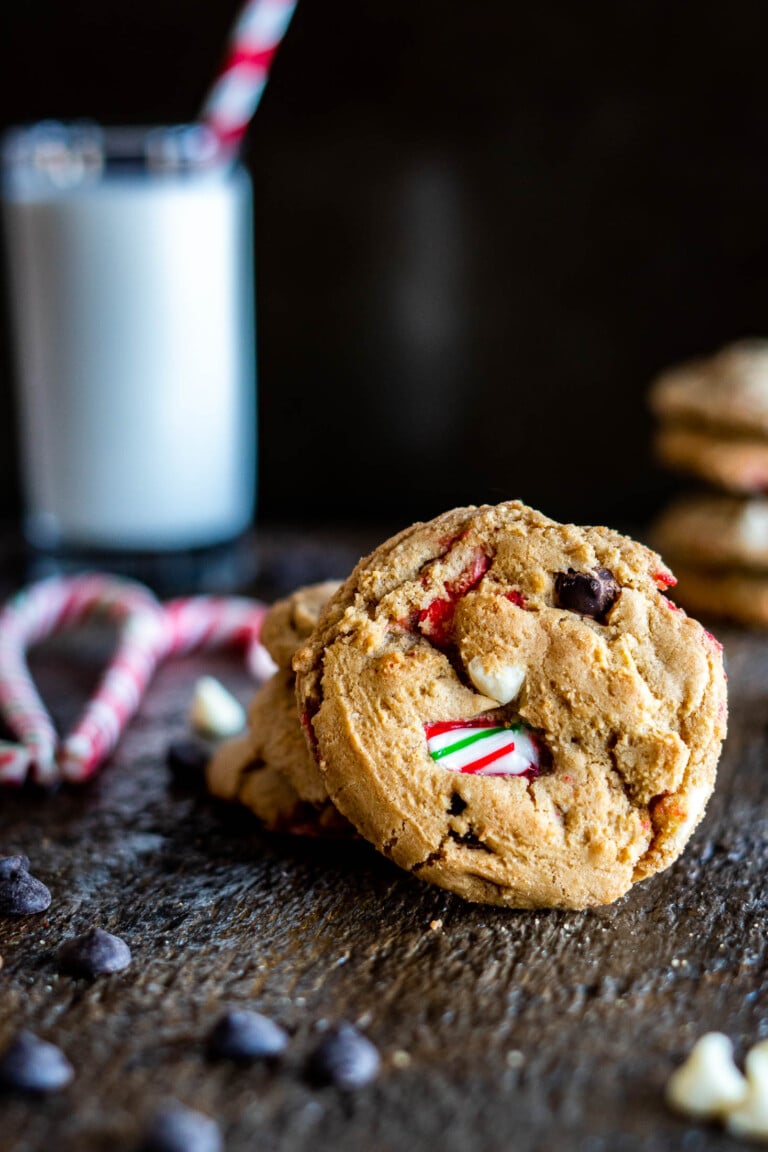 Crushed candy cane cookies with a glass of milk.