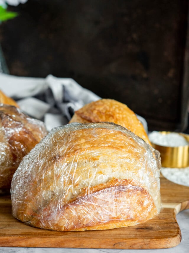 Half a loaf of sourdough wrapped in plastic.