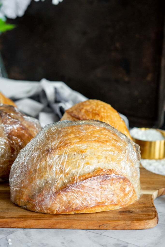 Half a loaf of sourdough wrapped in plastic.