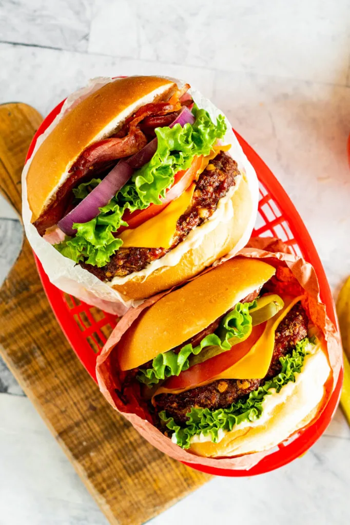 Two smoked burgers in a basket.