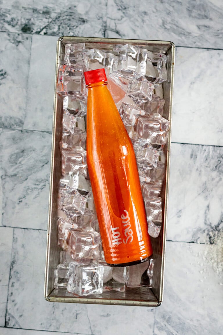 Hot sauce in a bucket of ice.