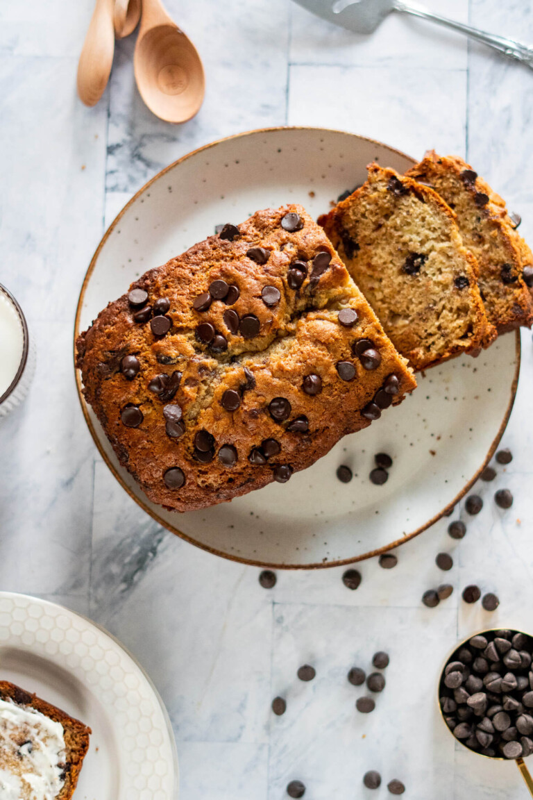 Overhead of sliced sourdough banana bread with chocolate chips.