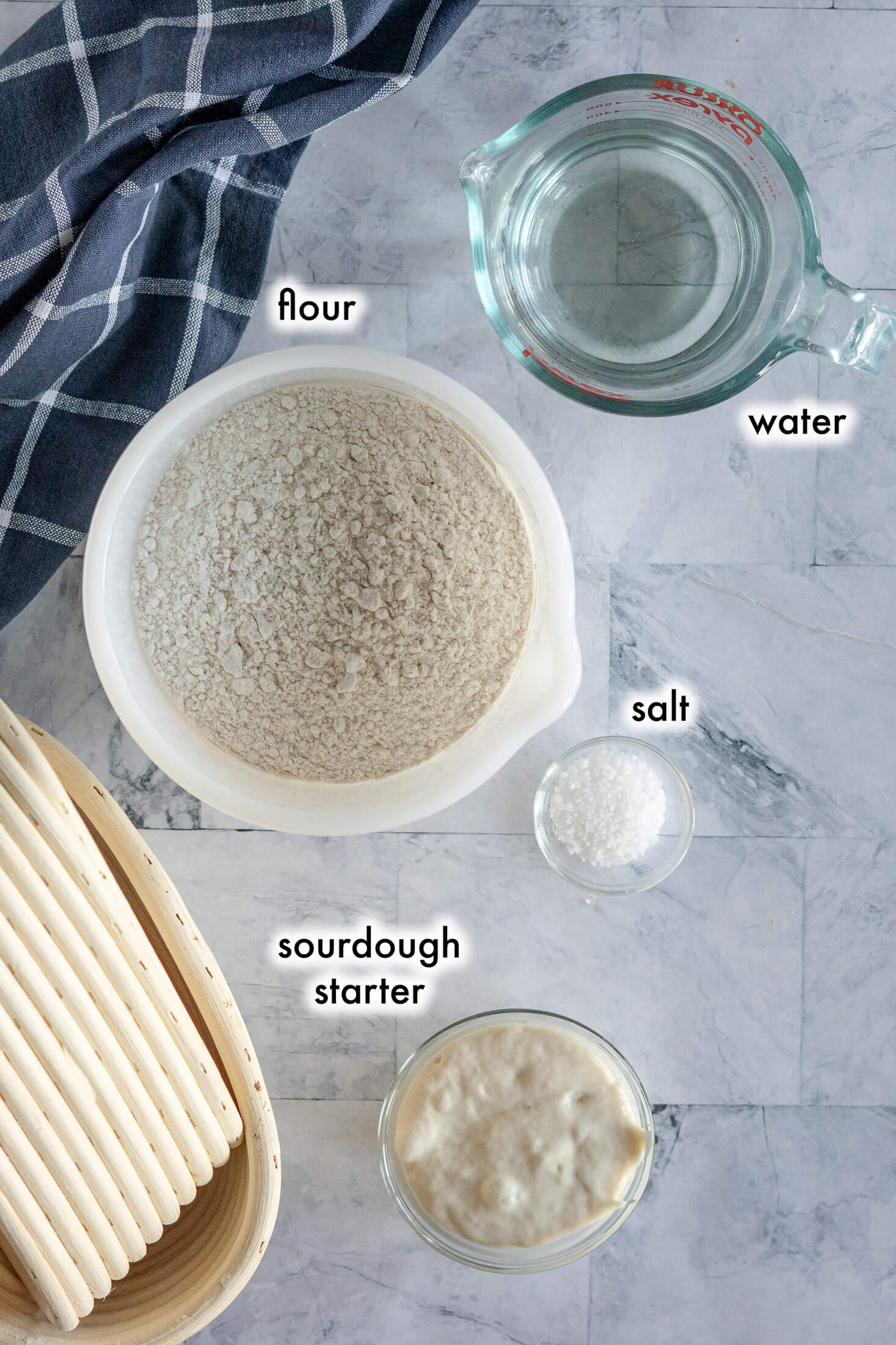 Labelled ingredients for this recipe; flour, water, salt, sourdough starter. 