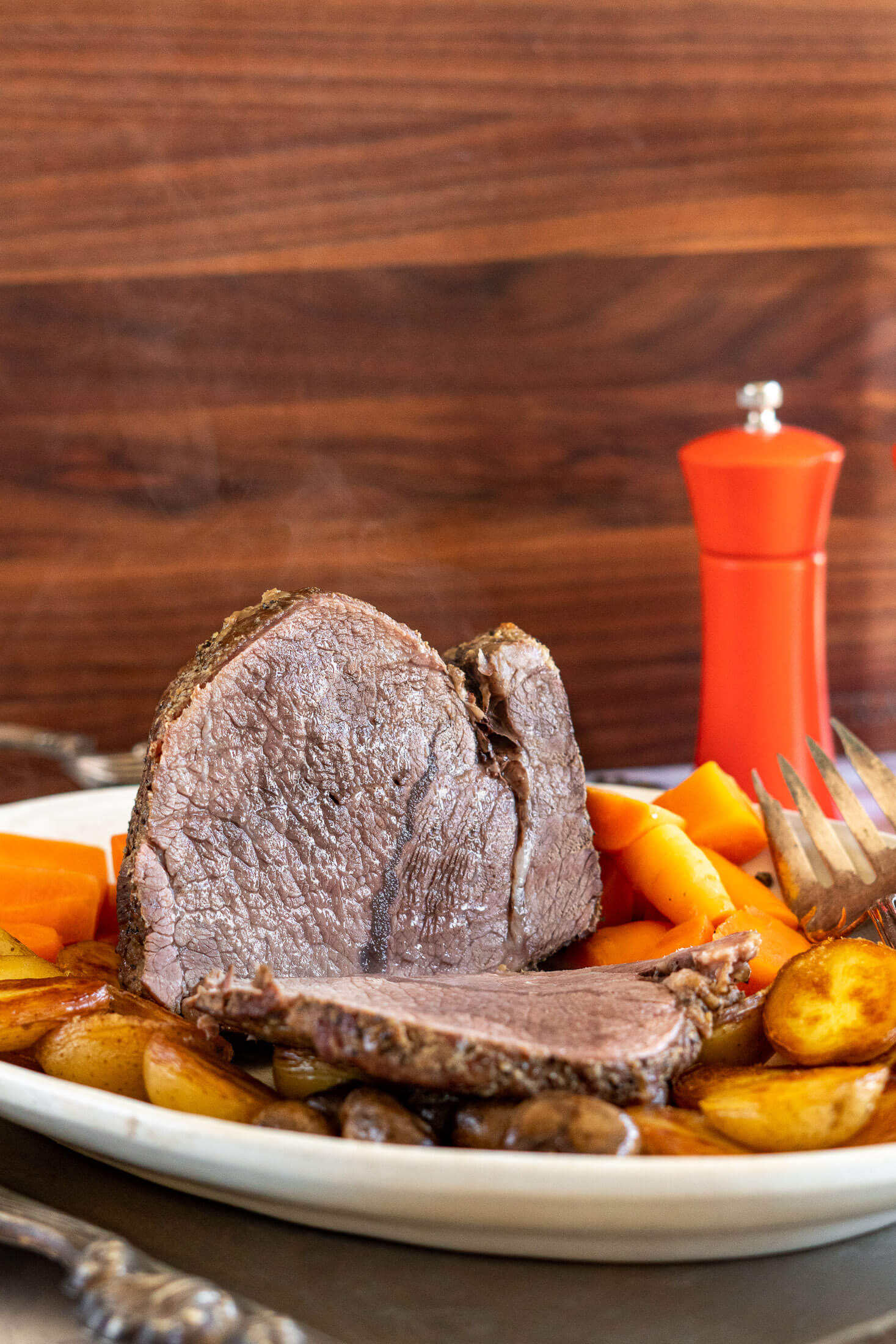 Steaming sliced cross rib roast.