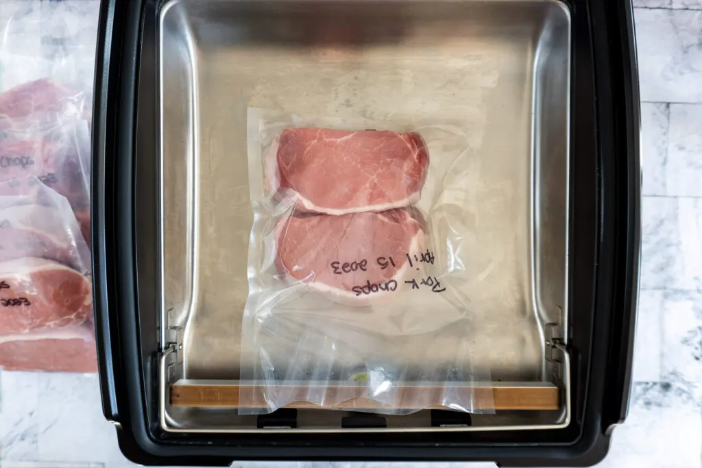Pork chops in vacuum sealer.