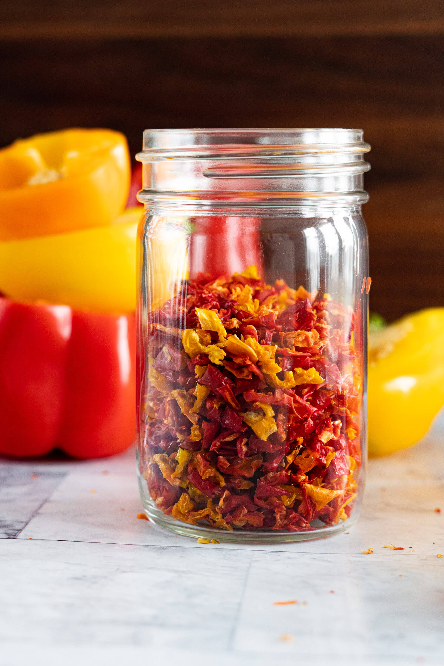 Dried sweet peppers in a mason jar.