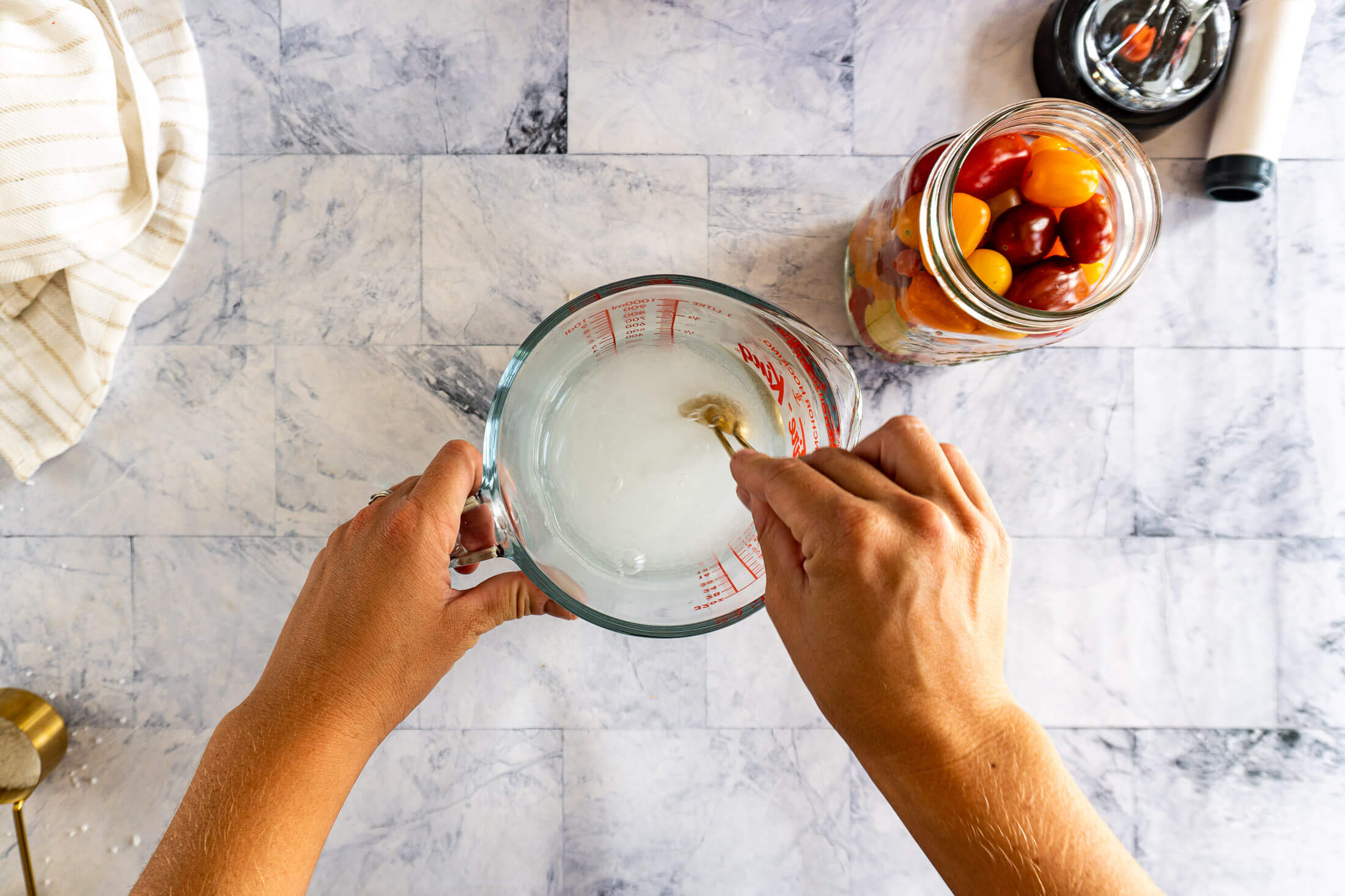 Stirring salt and vinegar brine. 